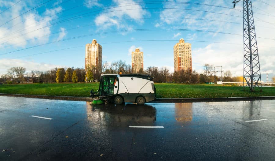 cityscape with the street cleaning machine ravo